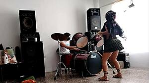 She drums wildly then strips teasing her huge curvy ass for neighbors