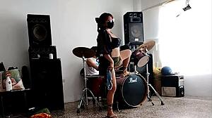She drums wildly then strips teasing her huge curvy ass for neighbors