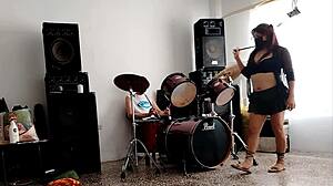 She drums wildly then strips teasing her huge curvy ass for neighbors