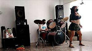 She drums wildly then strips teasing her huge curvy ass for neighbors