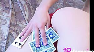 Young 18+ ana fey strips topless teasing natural tits with poker cards