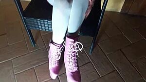 Latina milf lounges in pantyhose and heeled boots on chair