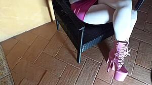 Latina milf lounges in pantyhose and heeled boots on chair