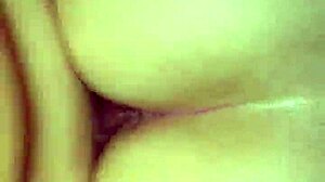 He slides into her tight ass while the buttplug stretches her wide