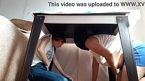 i sneak under the desk in my miniskirt and jeans to rub my wet pussy while stepparents eat nearby