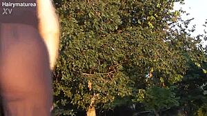 Hairy chubby mature flashes beaver through see-through outfit outdoors publicly