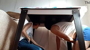 i sneak under the desk in my miniskirt and jeans to rub my wet pussy while stepparents eat nearby