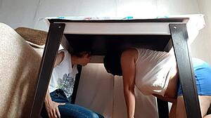 i sneak under the desk in my miniskirt and jeans to rub my wet pussy while stepparents eat nearby
