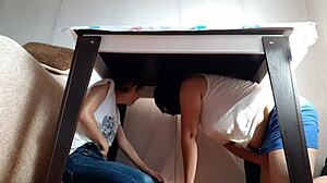 i sneak under the desk in my miniskirt and jeans to rub my wet pussy while stepparents eat nearby