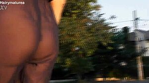 Hairy chubby mature flashes beaver through see-through outfit outdoors publicly