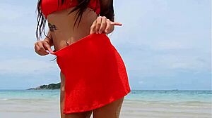 i flash my petite body in orange bikini dancing and fingering on the beach public fun