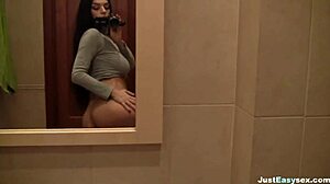 busty babe spreads legs to finger her hairy pussy deep