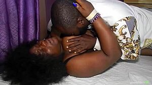 Tall black stud devours African babe's wet pussy on bed until she squirts everywhere