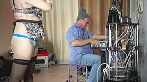 a naked submissive maid cleans the silly engineer's office under his dominant gaze