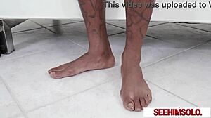 boschi pope bends flexible tattooed body fingering feet while stroking thick black cock