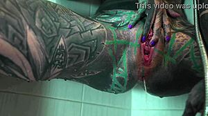 Heavily tattooed petite goth model fingers gaping asshole and squirts in shower