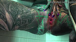 Heavily tattooed petite goth model fingers gaping asshole and squirts in shower