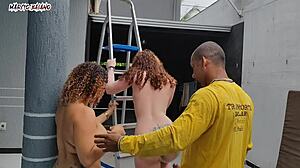 Naked hosts tease visitor in garage surprise
