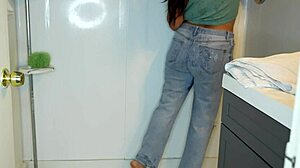 latina soaks her jeans panties then strips for wet shower