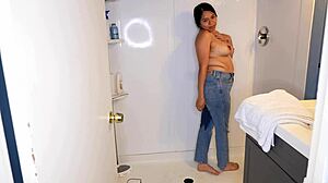 latina soaks her jeans panties then strips for wet shower
