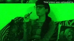 beth kinky sexy goth domina smokes cigarette in green light hd pt1!