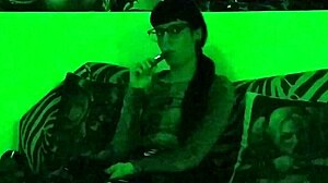 beth kinky sexy goth domina smokes cigarette in green light hd pt1!
